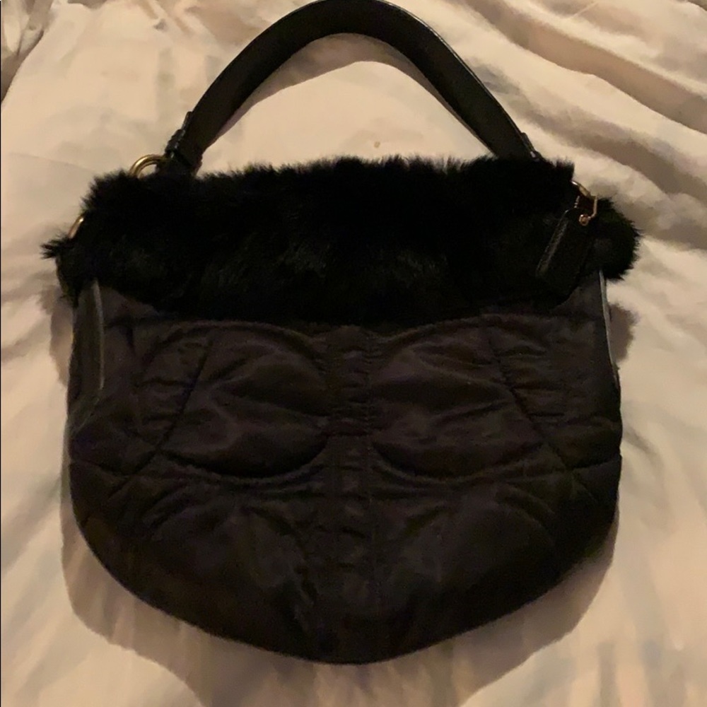 Like new Coach Bag with fur lining on top of bag.